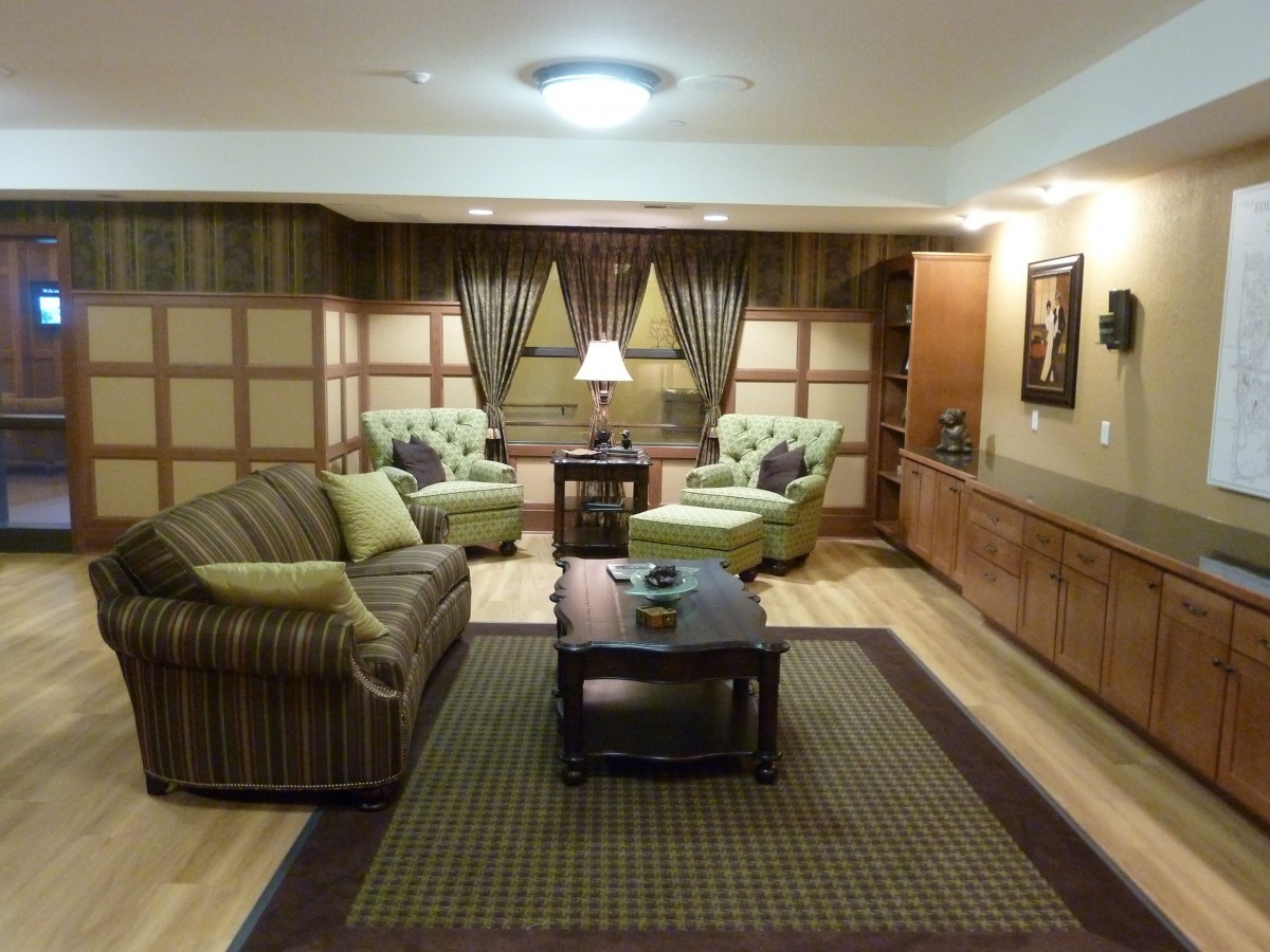 A cozy living room with comfortable seating and warm lighting.