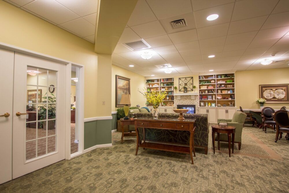 A cozy office lounge area with a bookshelf and comfortable seating.