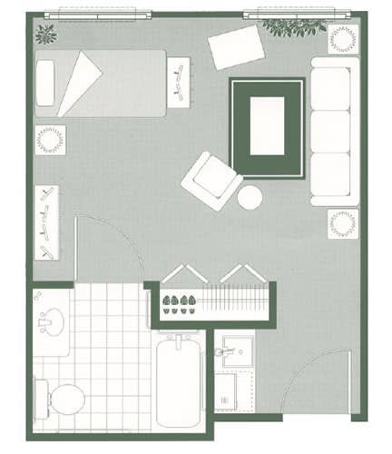 A floor plan of a studio apartment featuring a bedroom, living area, kitchen, and bathroom.
