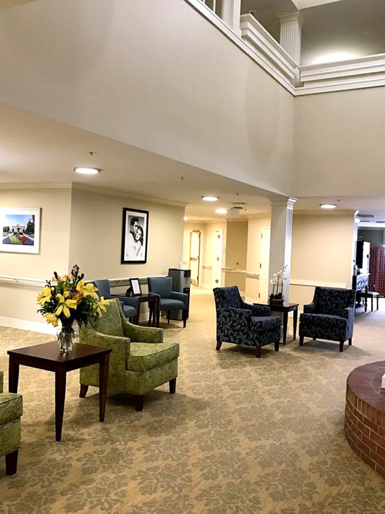 A well-lit lobby area with comfortable seating and decorative elements.