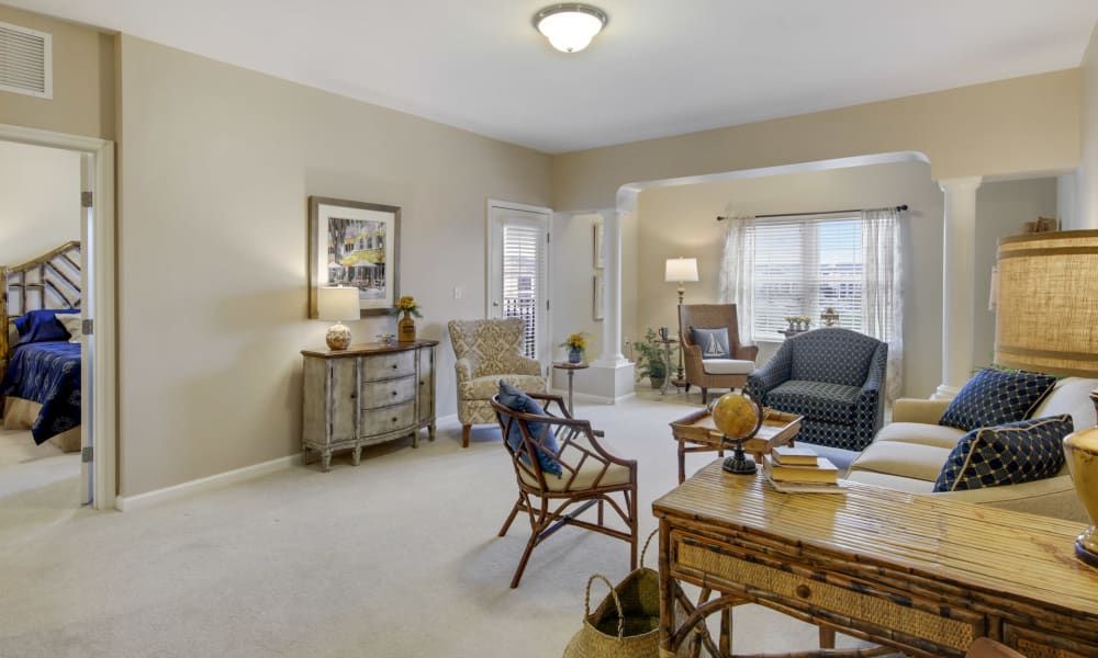 A spacious living room with comfortable seating and natural lighting.