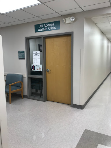 Entrance to a medical clinic with seating in the waiting area.
