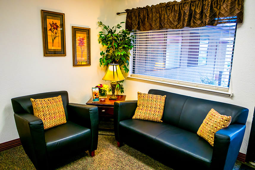 Cozy living room with leather seating and decorative elements.