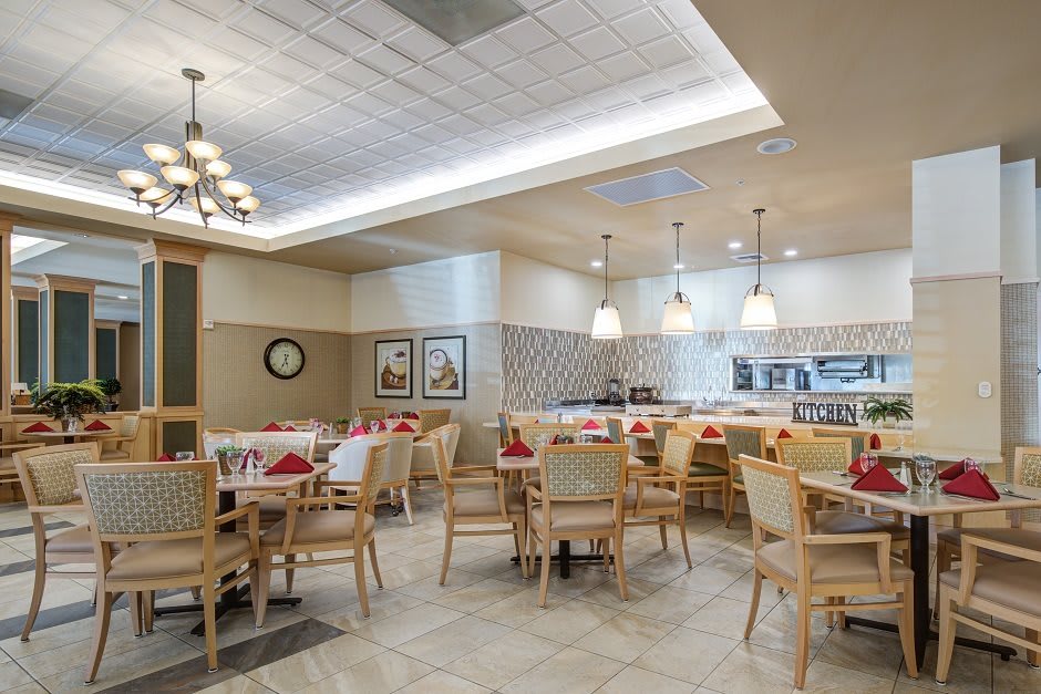 A cozy restaurant dining area with neatly arranged tables and chairs.