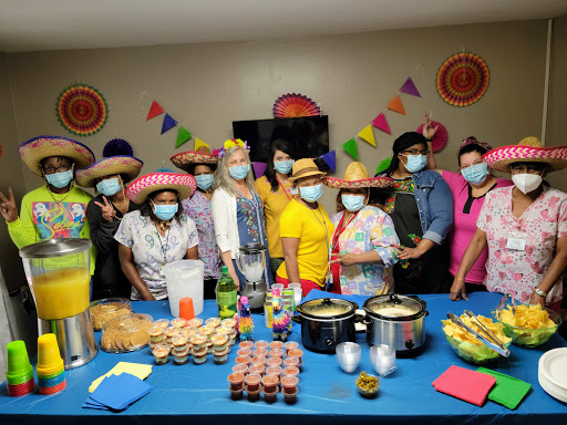 A lively gathering celebrating together with delicious food and festive attire.