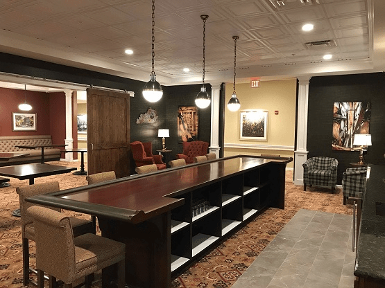 A spacious and elegantly decorated lounge area with comfortable seating and stylish lighting.