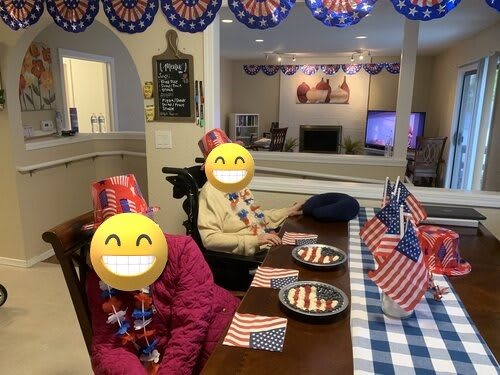 A festive indoor celebration with patriotic decorations and American flags.