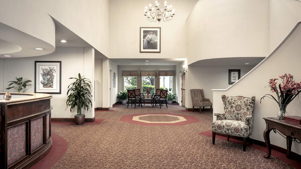 Spacious lobby with elegant furniture and decor.