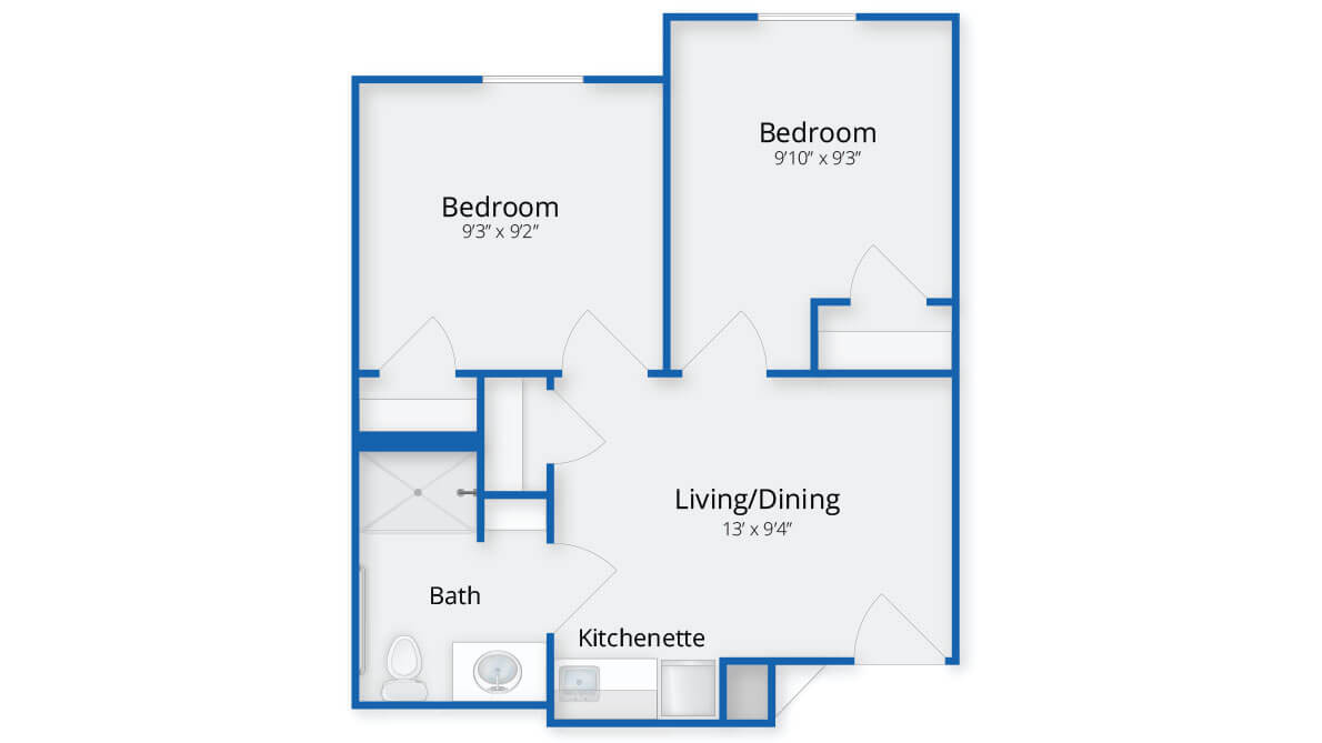 A floor plan of a two-bedroom apartment with a living/dining area, bathroom, and kitchenette.