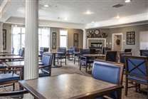 A modern dining area with tables and chairs set up for guests.