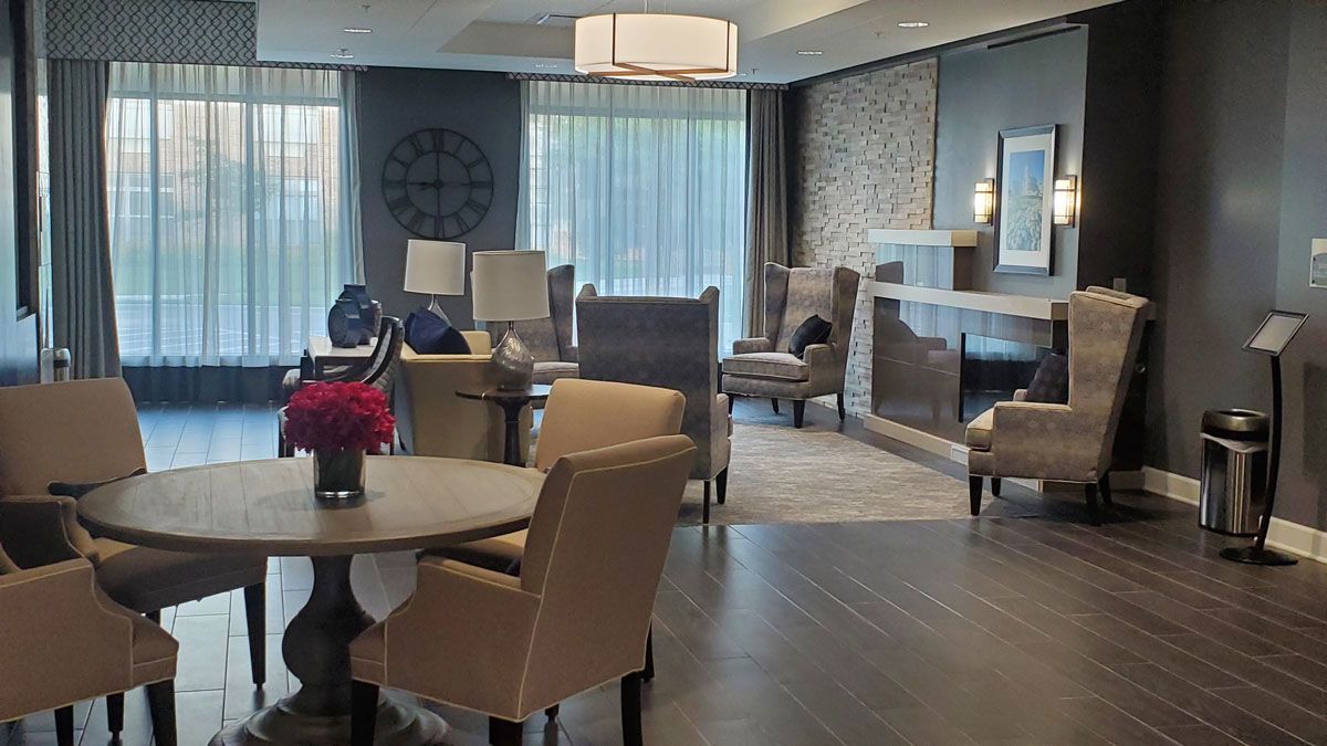 A modern and elegantly designed living room with comfortable seating and tasteful decor.