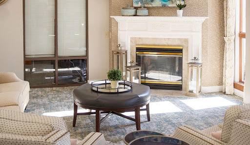 A cozy and modern living room featuring a stylish coffee table and an elegant fireplace.