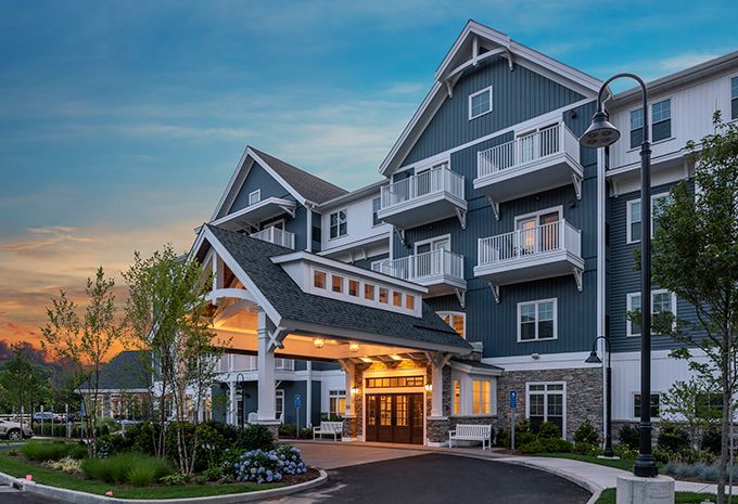 A beautifully lit hotel entrance during the evening.
