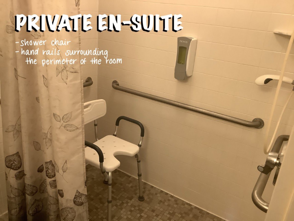 Accessible private en-suite bathroom with shower chair and grab bars.