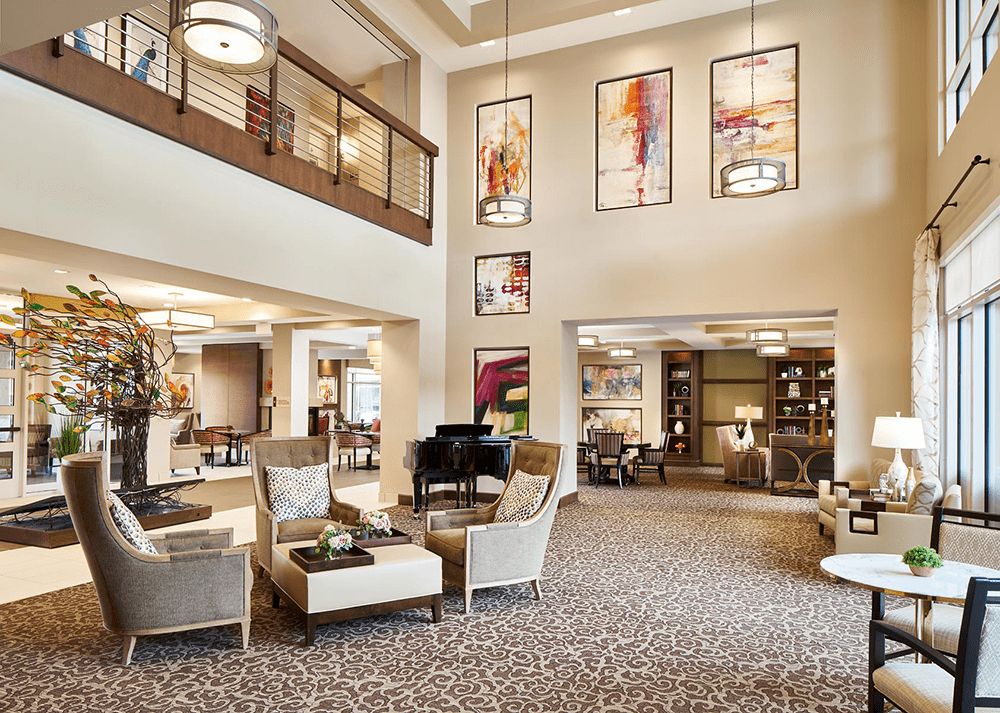 A stylish and modern lobby featuring comfortable seating, contemporary artwork, and elegant lighting.