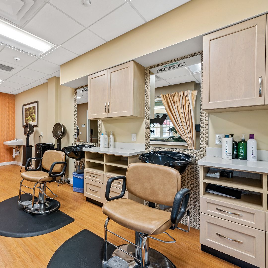 A well-equipped hair salon with chairs and mirrors, ready for clients.