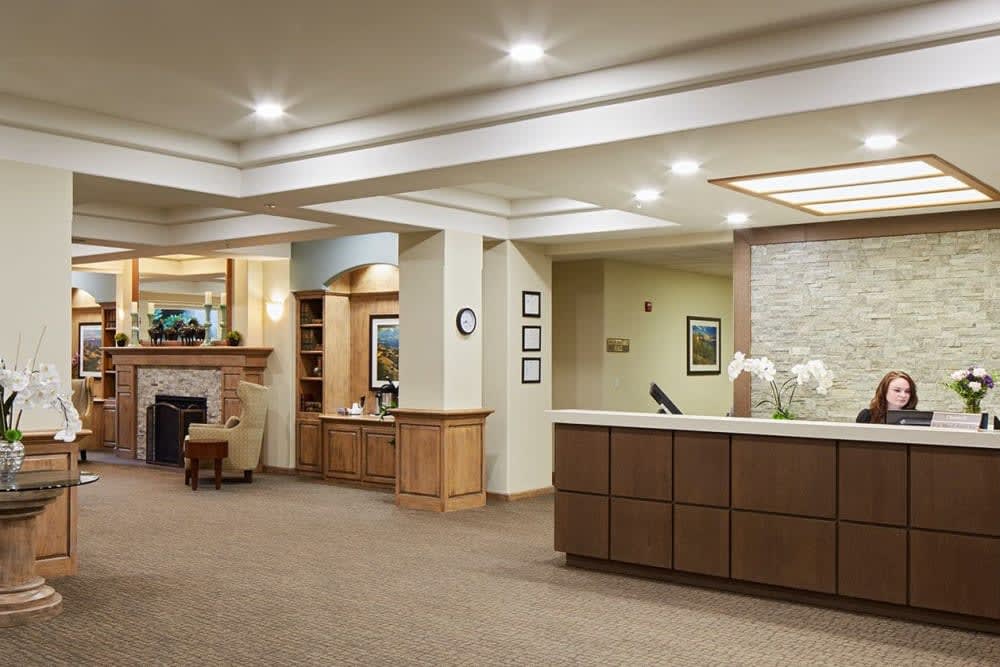 A modern reception area with a welcoming desk and comfortable waiting space.