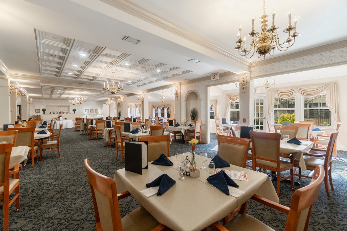 An elegant dining room with neatly set tables and sophisticated decor.