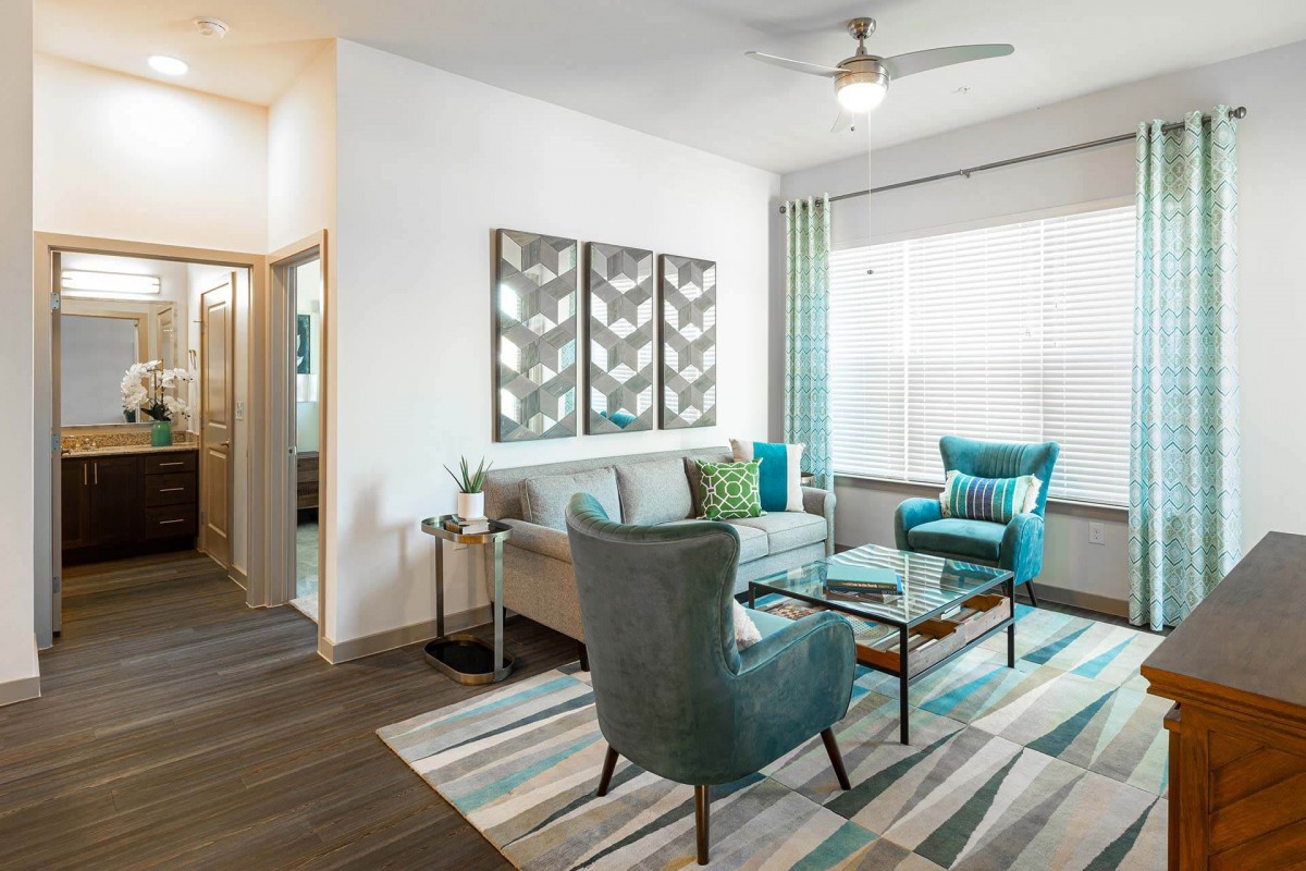 A modern living room with stylish furniture and contemporary artwork.