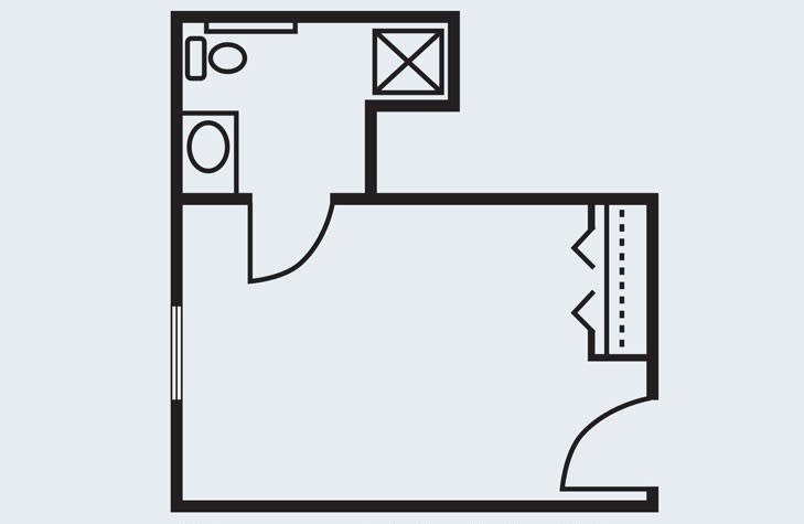 A compact floor plan featuring a small bathroom and open living area.