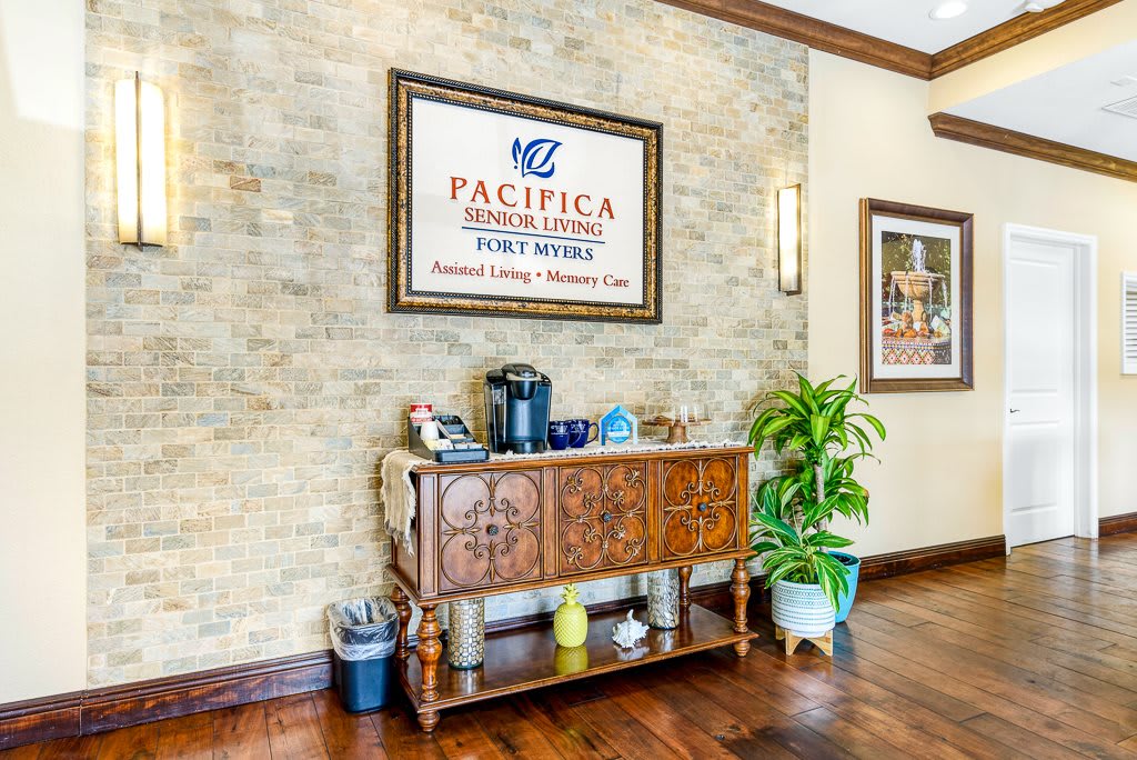 A welcoming reception area with a coffee station and decorative signage.