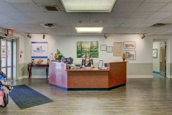 A spacious office reception area with a central desk and welcoming atmosphere.