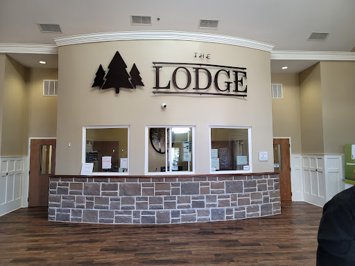 The welcoming reception area of a lodge with a rustic design.