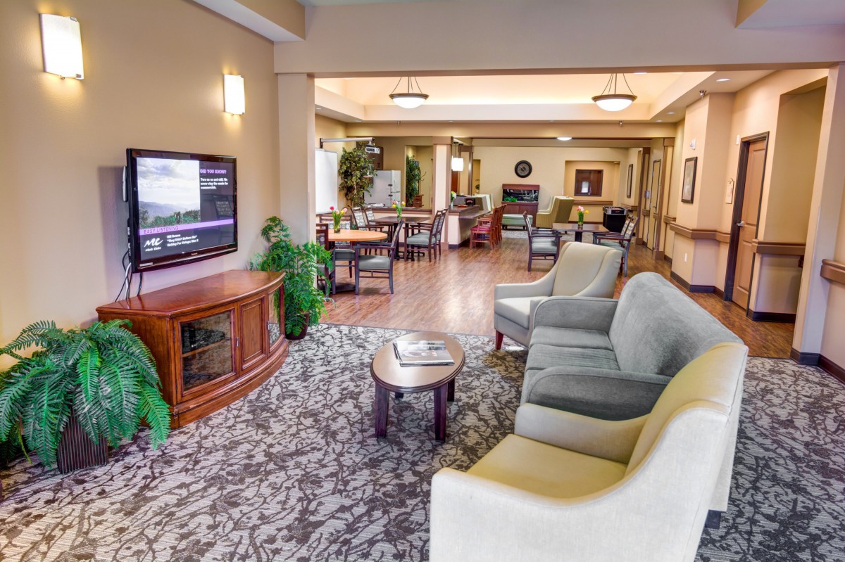 A cozy living room with comfortable seating and a television.