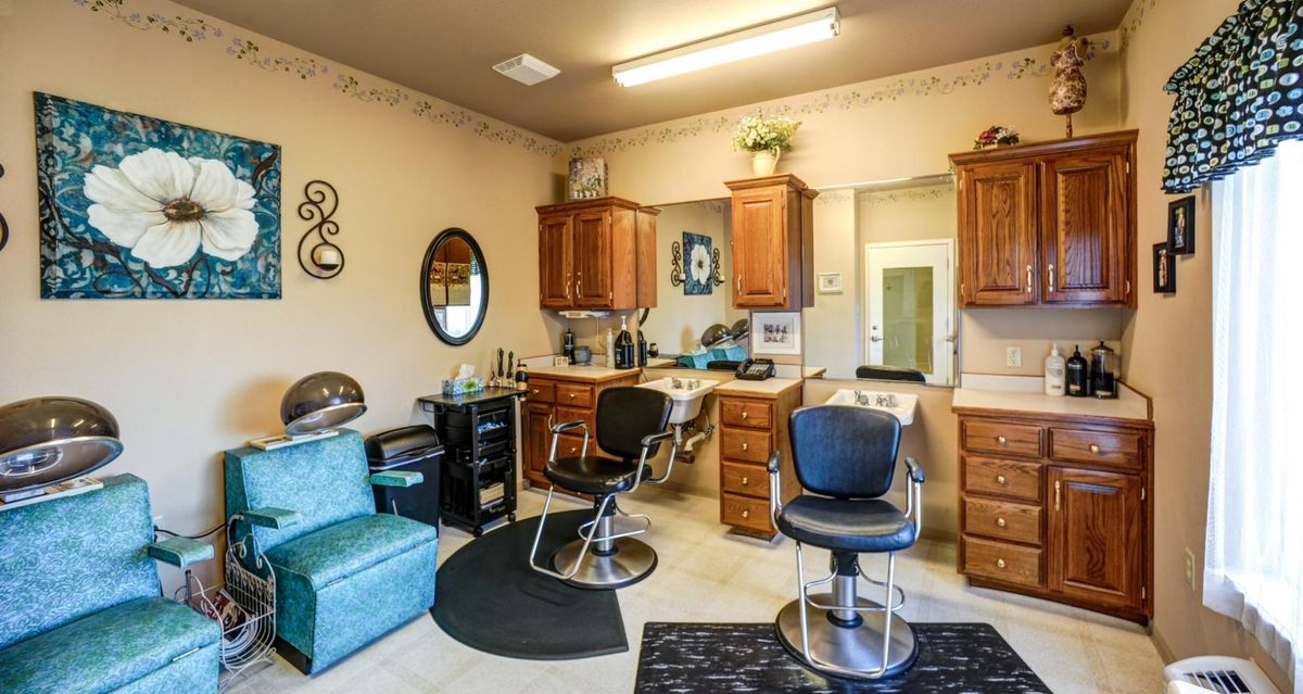 A well-organized hair salon interior with styling chairs and mirrors.
