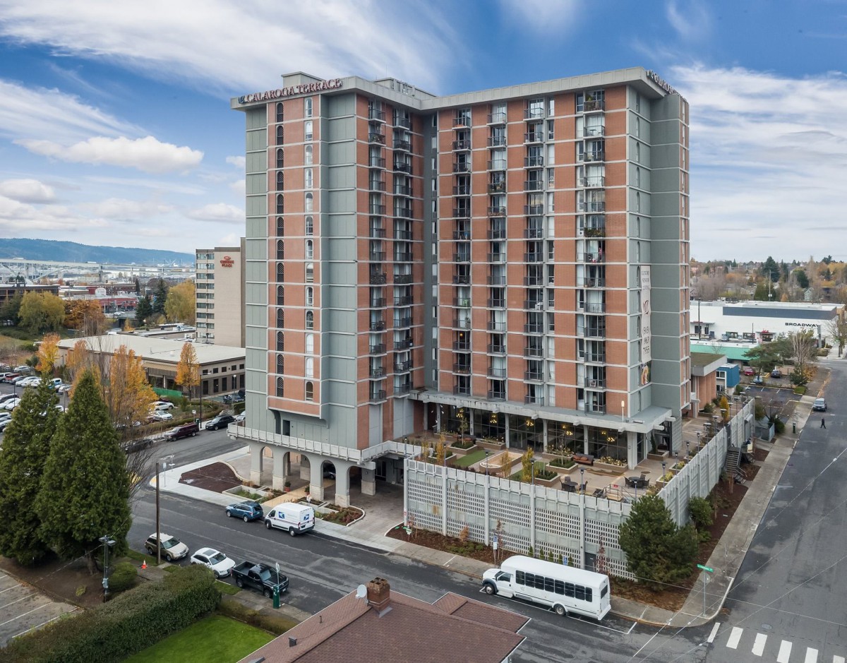 A modern hotel building in an urban cityscape.
