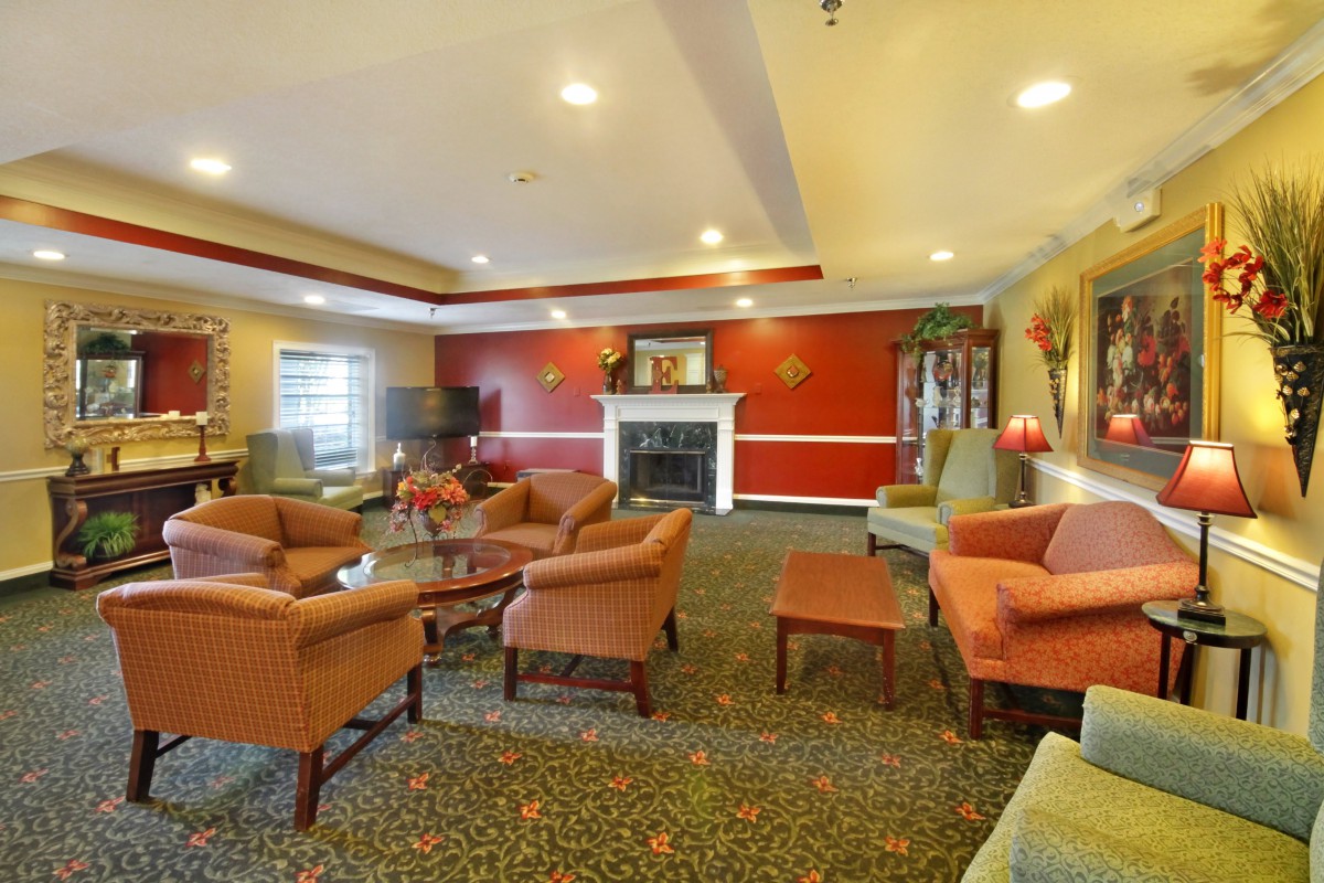 A cozy living room with comfortable seating and a fireplace.