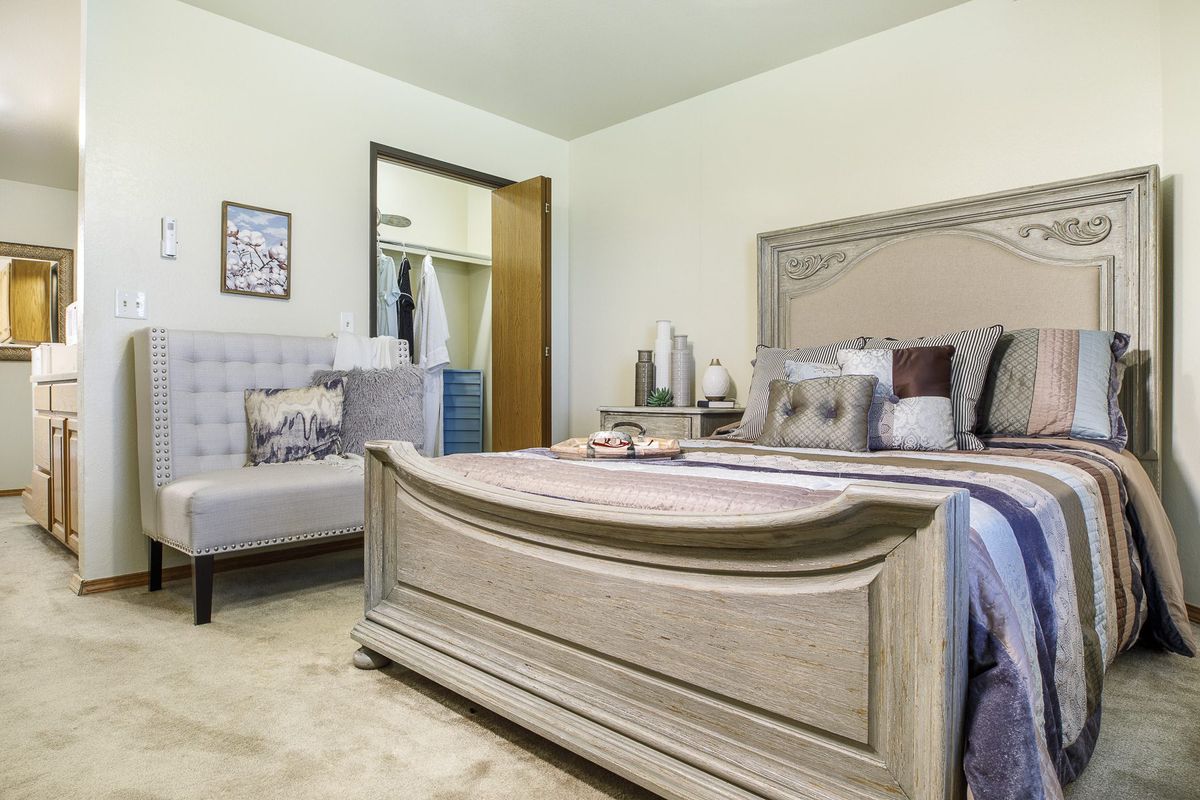 A cozy and well-decorated bedroom with a large bed and stylish furniture.
