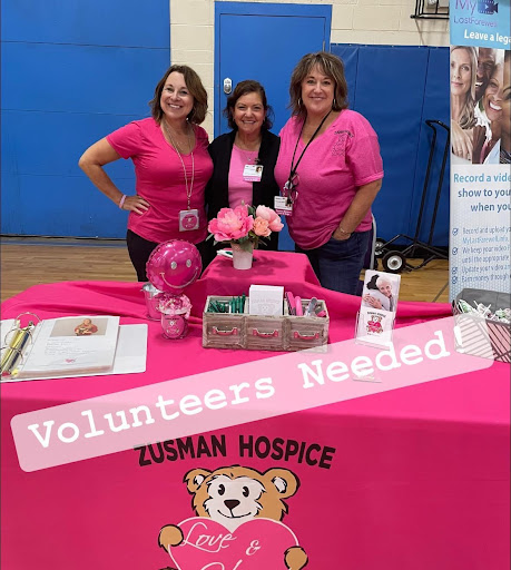 Community volunteers raising awareness for Zusman Hospice and inviting others to join their mission.