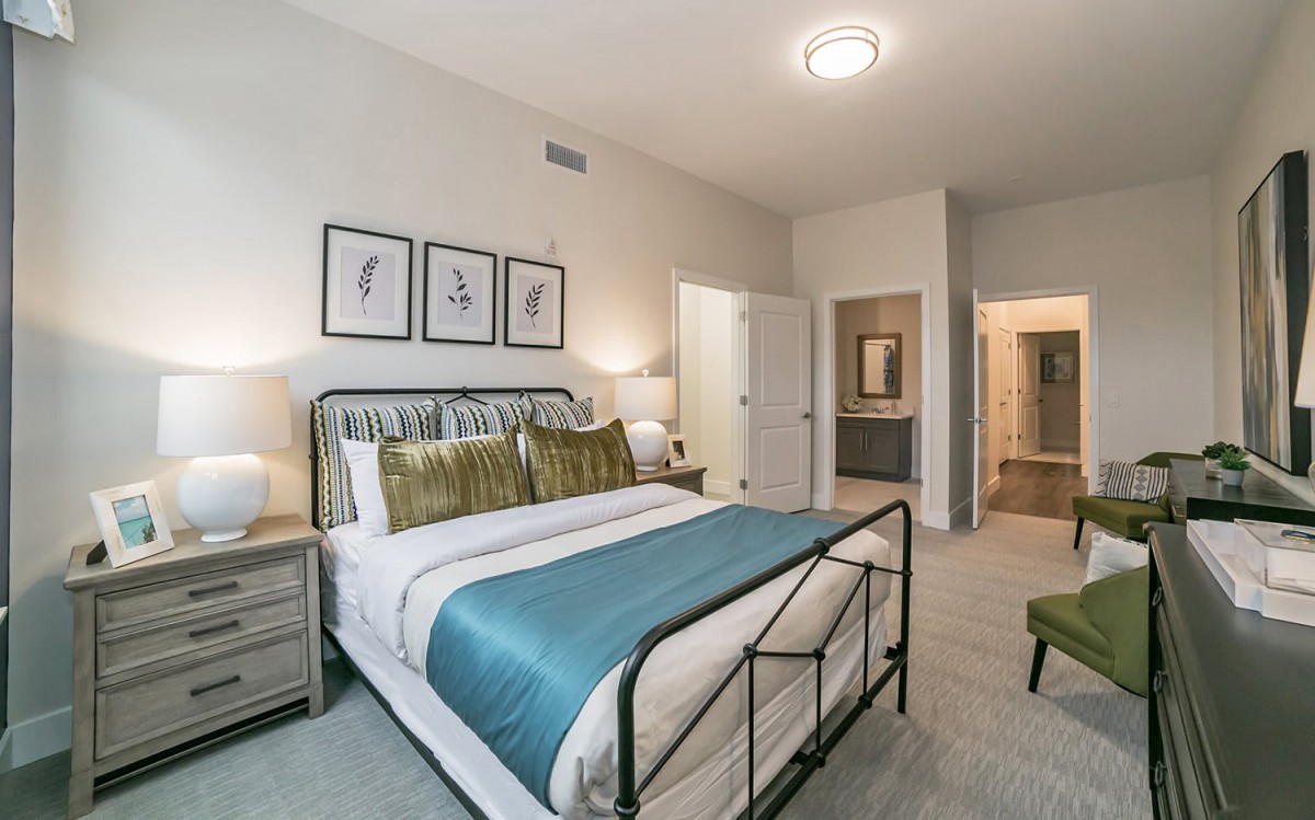 A modern bedroom with stylish decor and comfortable furnishings.