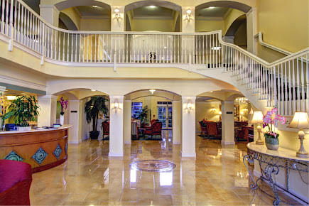 Luxurious hotel lobby with marble flooring and elegant decor.