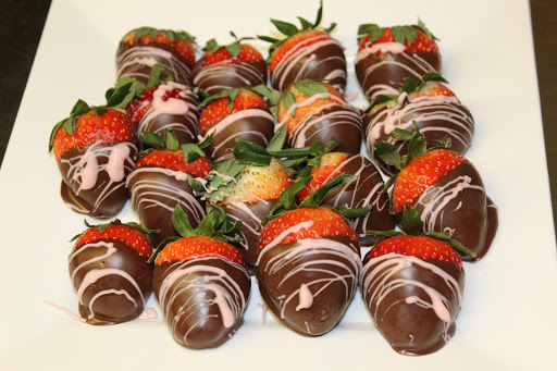 Delicious chocolate-covered strawberries, elegantly drizzled and ready to enjoy.