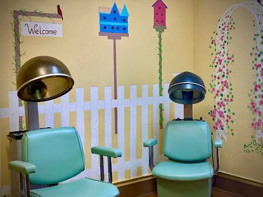 A charming vintage hair salon with colorful decor and retro styling chairs.