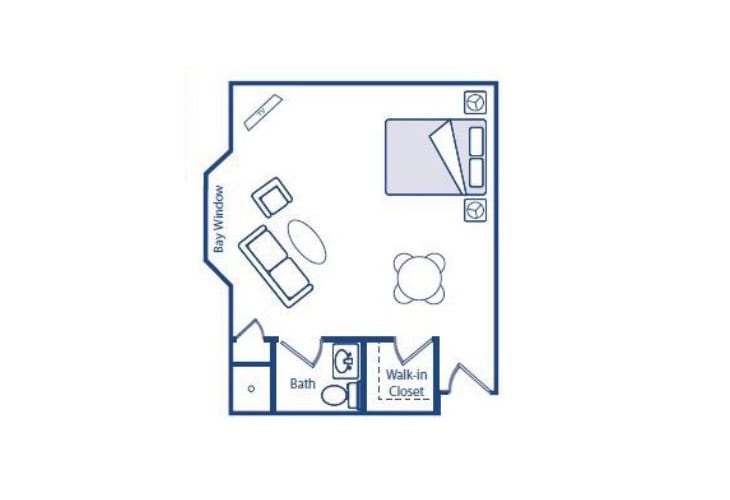 A floor plan of a studio apartment featuring a bedroom area, living space, kitchen, and bathroom.