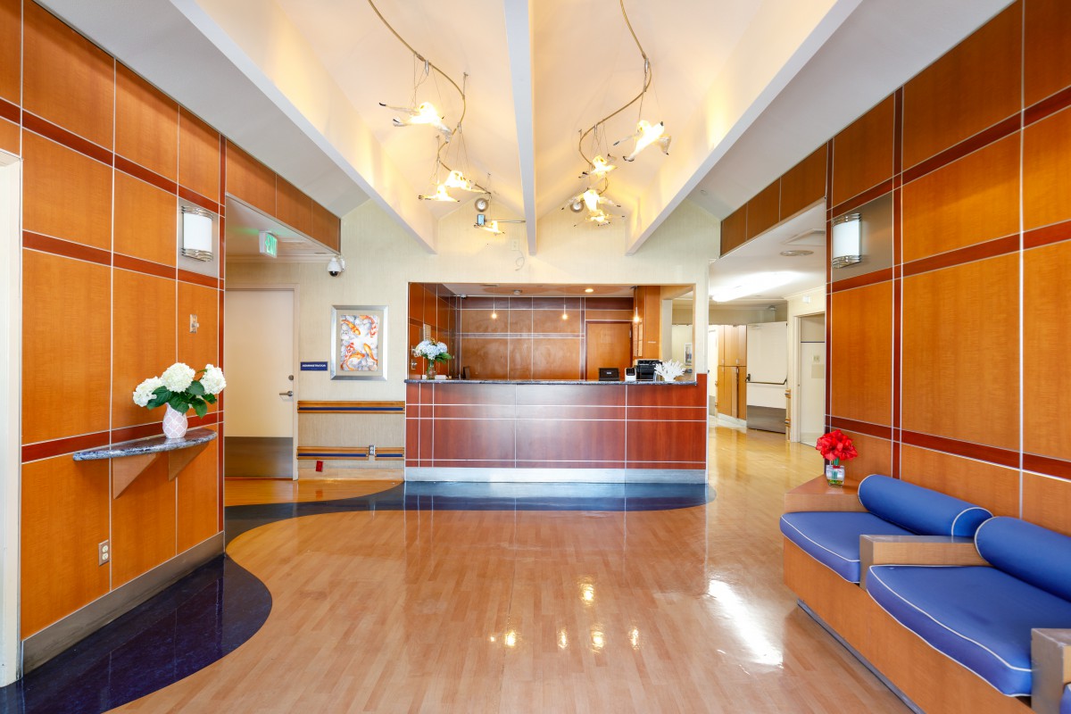 A modern reception area with stylish wood paneling and elegant lighting.