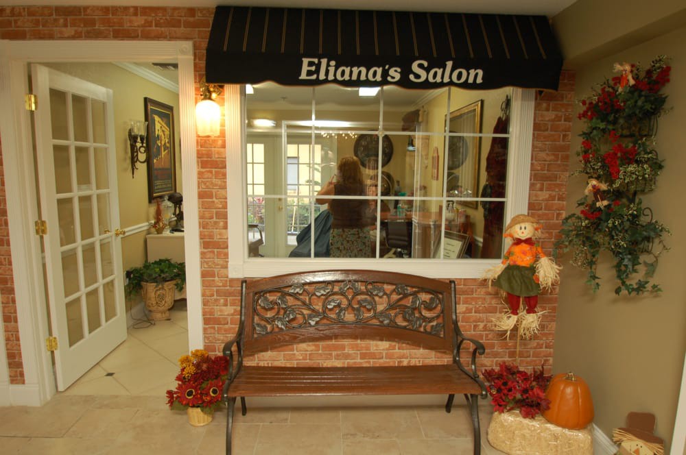 Entrance to Ellana's Salon with a decorative bench and awning.