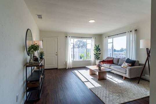 A bright and airy living room with modern decor and plenty of natural light.