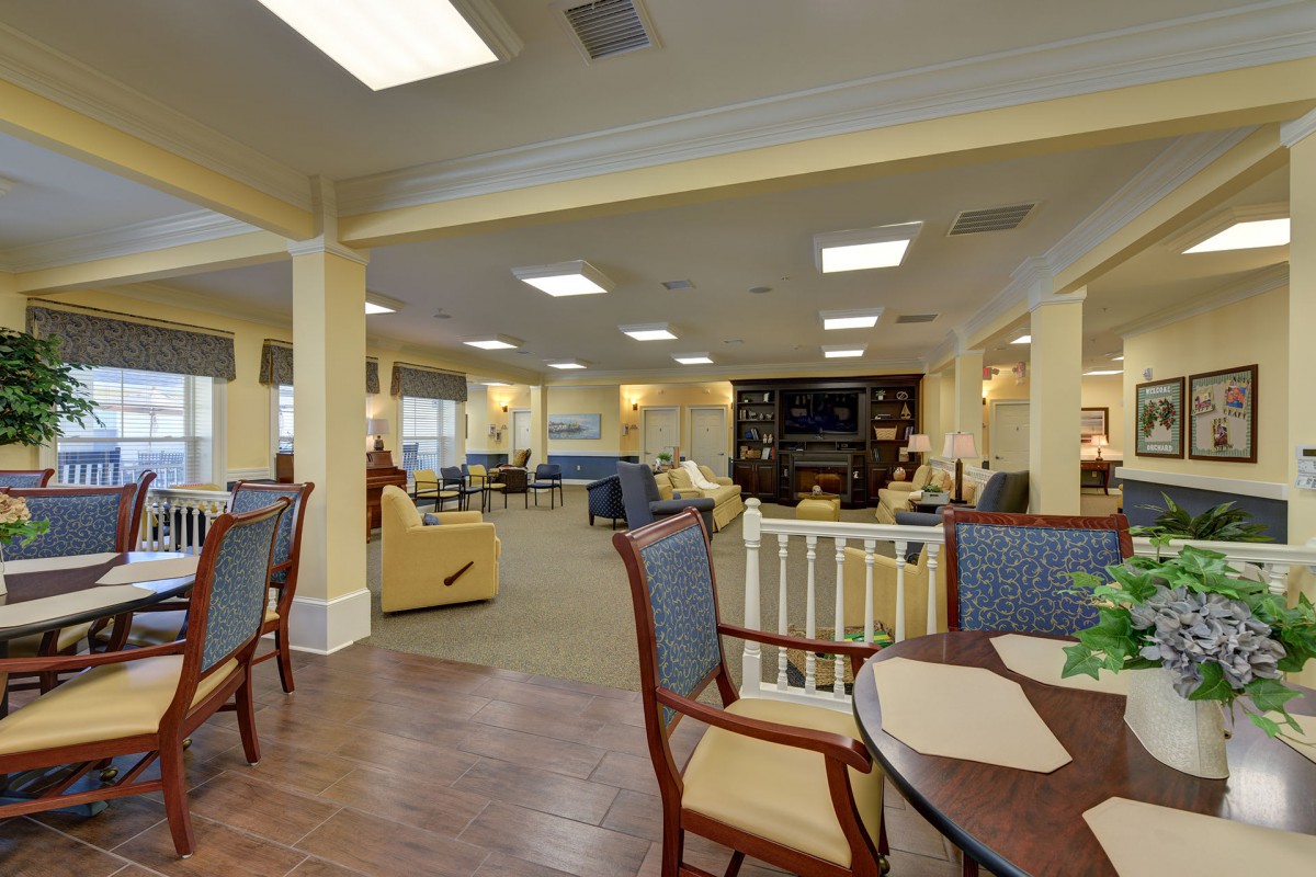 Comfortable communal living area with seating and tables.