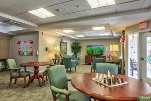 Cozy lobby area with seating and a chess board for relaxation.