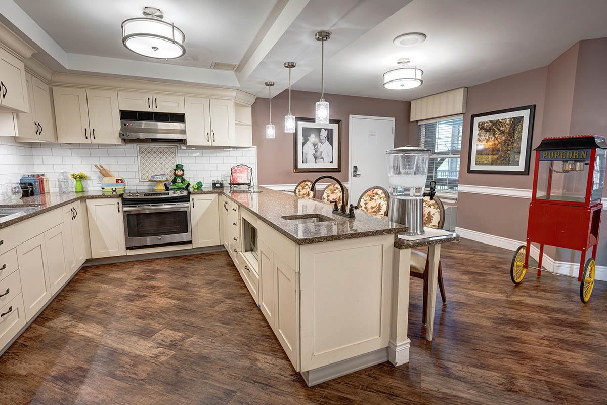 A modern kitchen and dining area with elegant lighting and decor.
