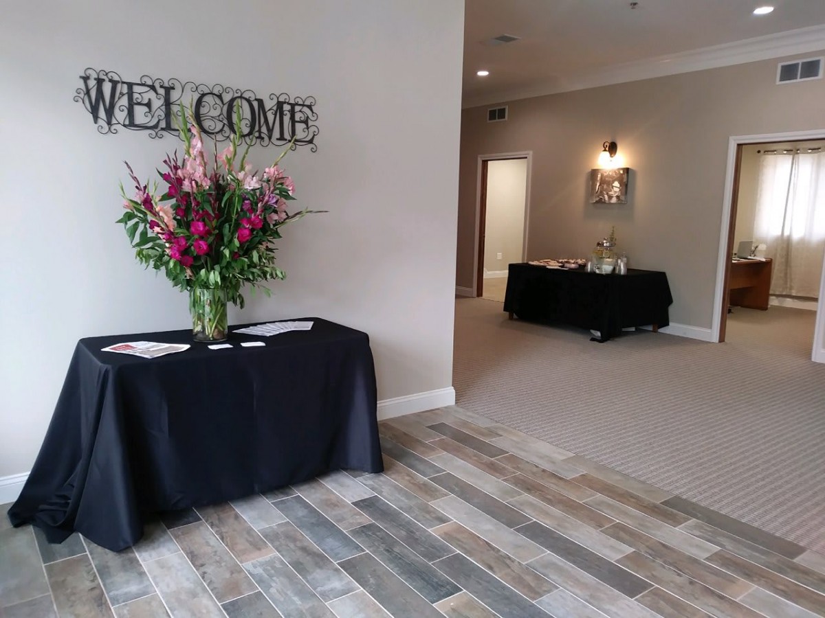 A welcoming reception area decorated with a floral arrangement on a table.