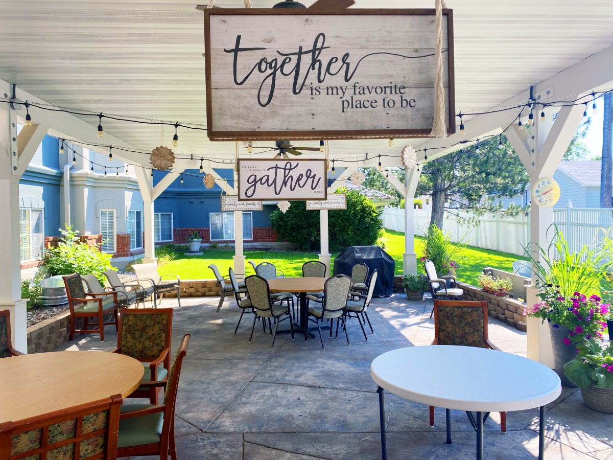 A cozy outdoor patio with inviting decor and ample seating, perfect for gatherings.