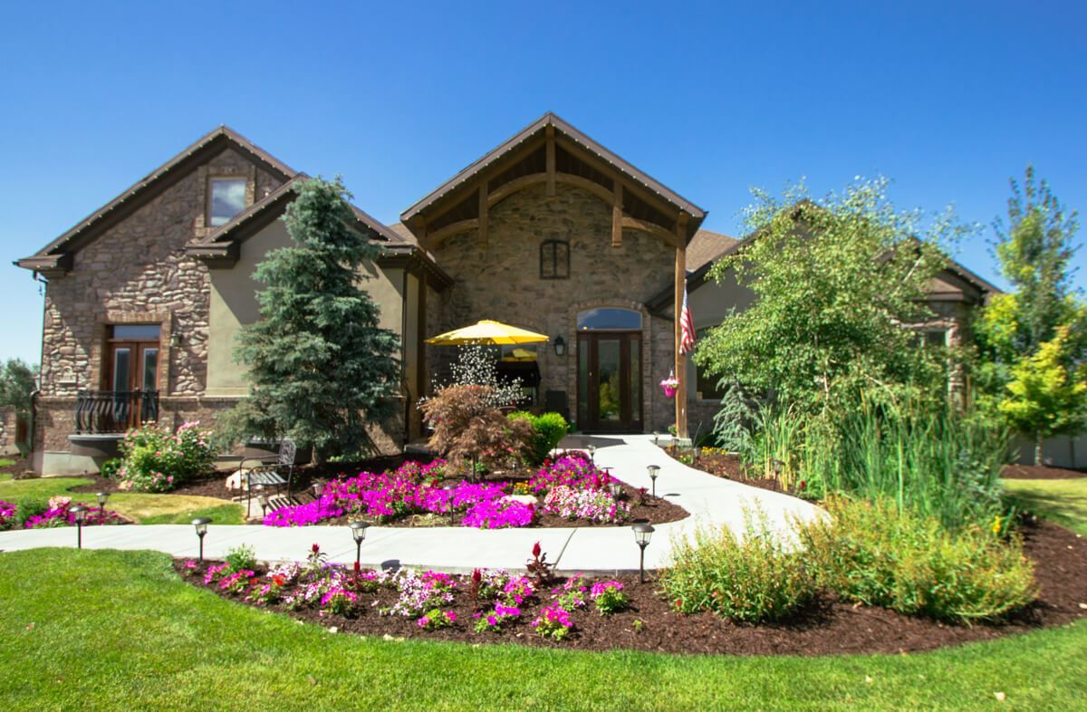 Beautiful house with a landscaped garden and vibrant flowers.