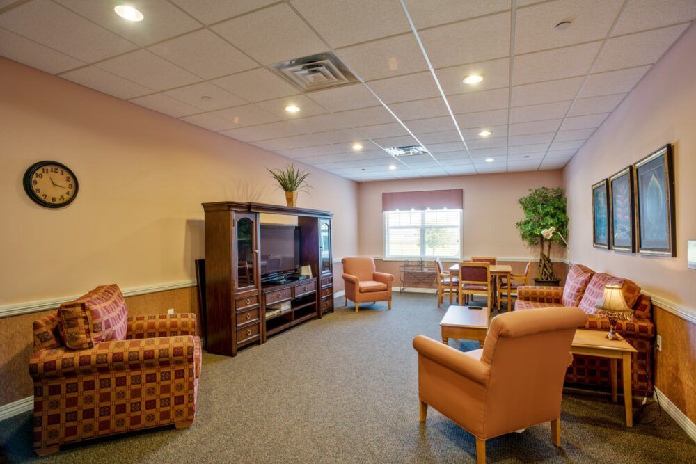 A cozy living room with comfortable seating and a television.