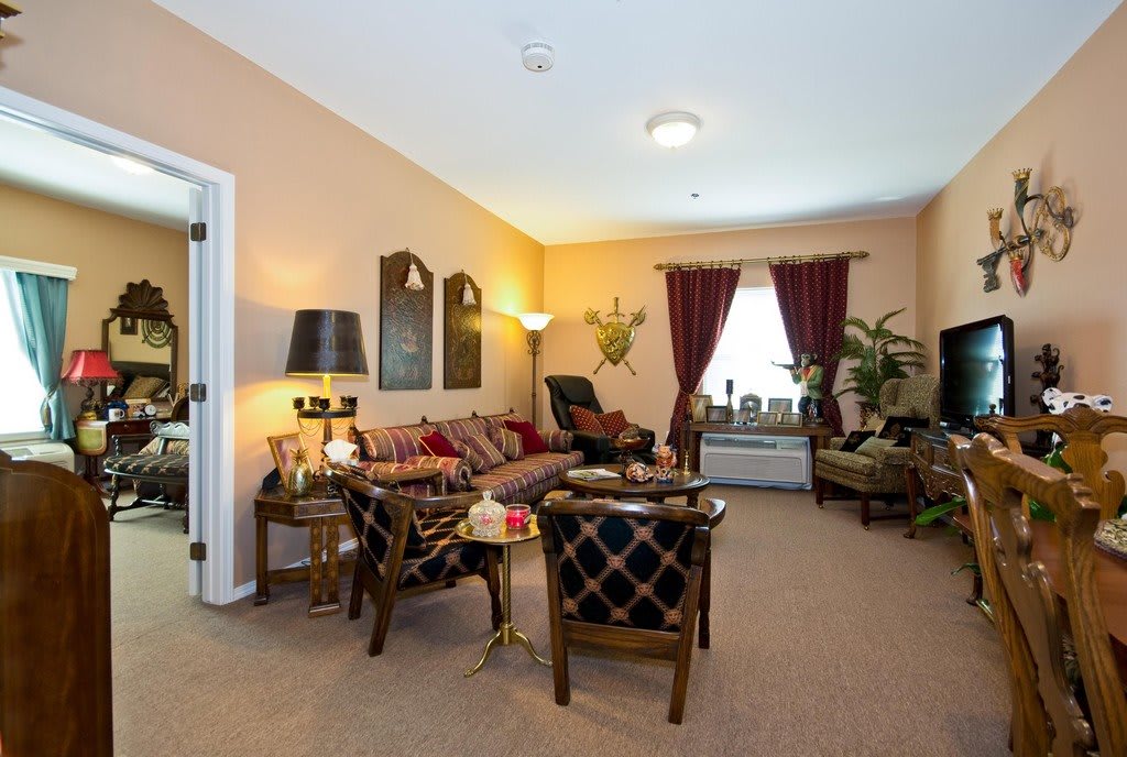 A cozy living room with comfortable seating and elegant dcor.