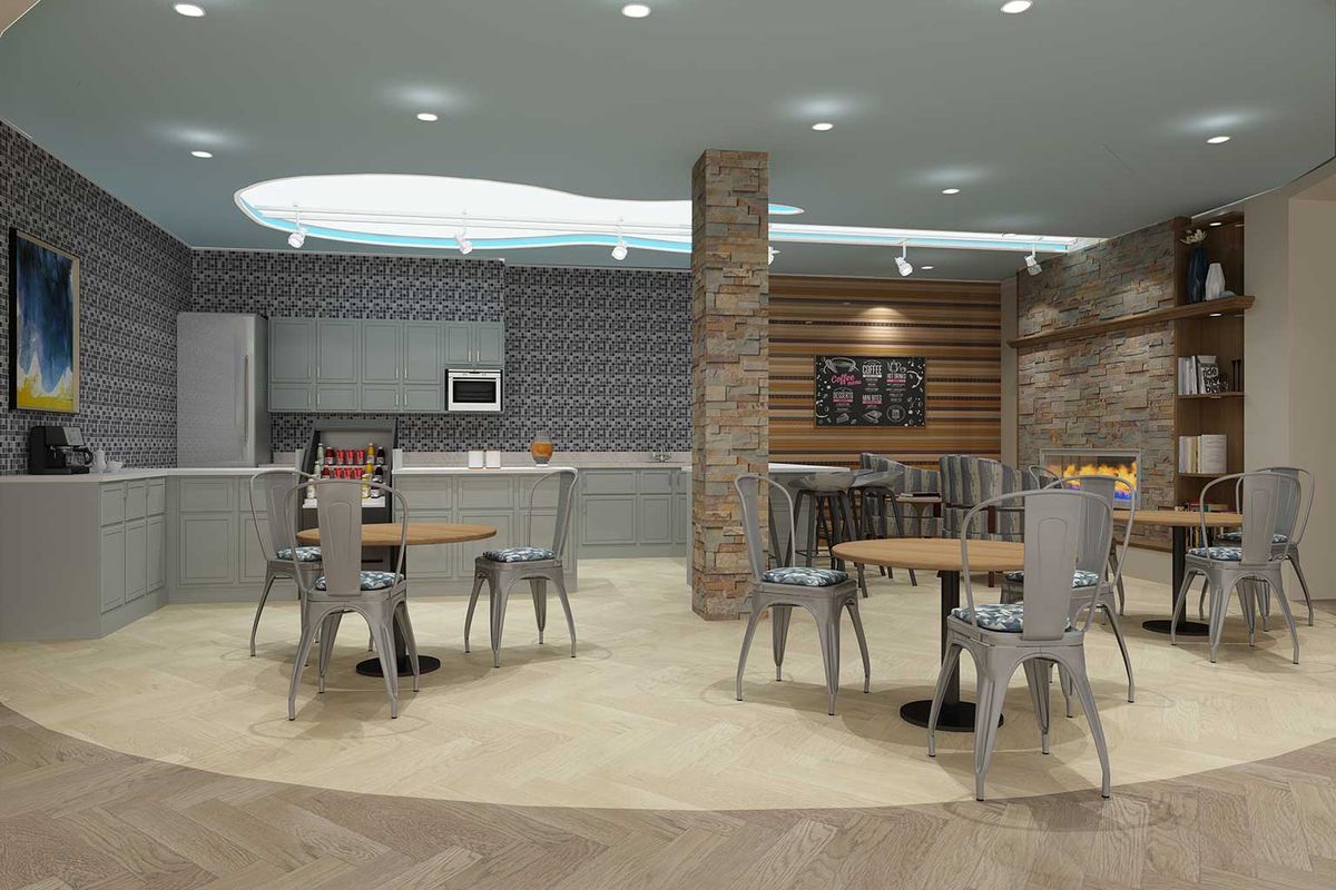 A modern cafeteria with stylish furnishings and a blend of brick, wood, and tile elements.